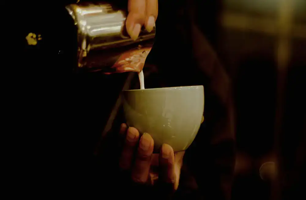 Barista pouring specialty coffee