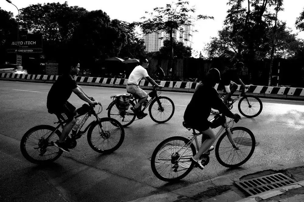 Cyclists riding together early in the morning