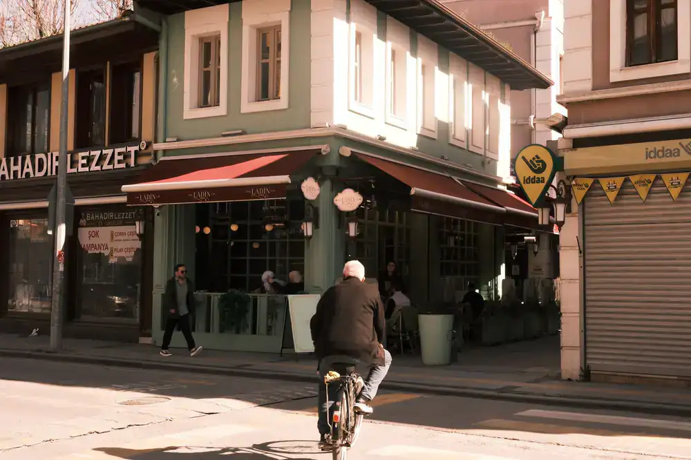 Cyclist arriving at the bicycle workshop and cafe