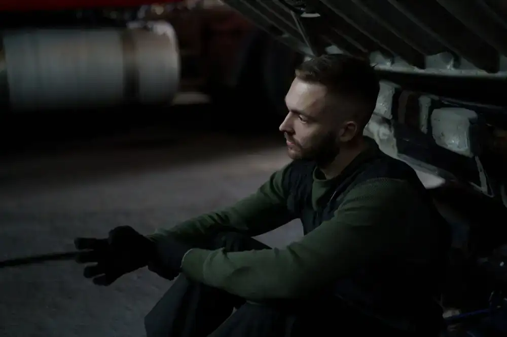 Mechanic taking a coffee break in the workshop