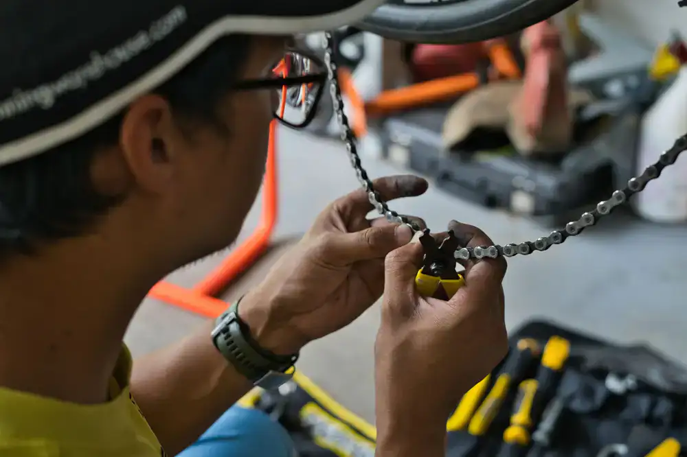 Close up of professional bicycle repair tools laid out on a clean workbench